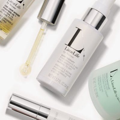 LimeLife skincare products on a gray background