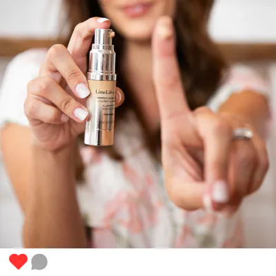 A woman holding LimeLife Perfect Glow Drops