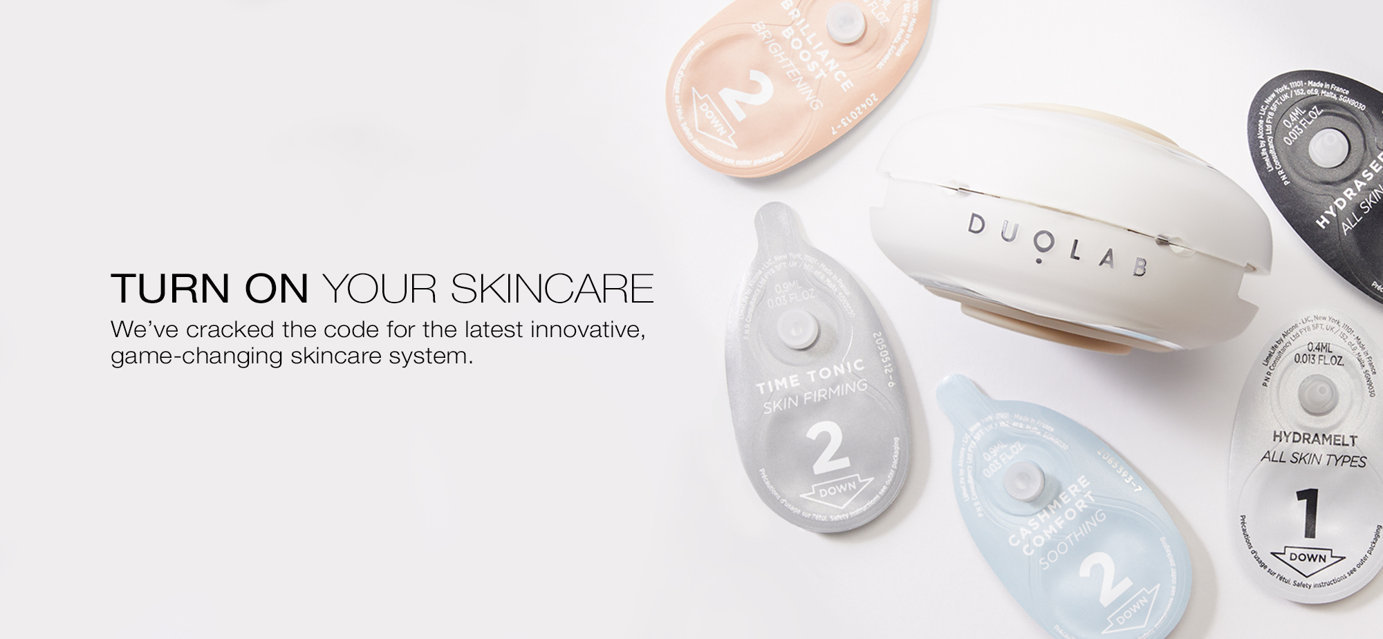 Duolab Skincare device with skincare capsules around it. 