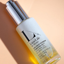 Bottle of LimeLife&#39;s One Drop Wonder on a peach background.